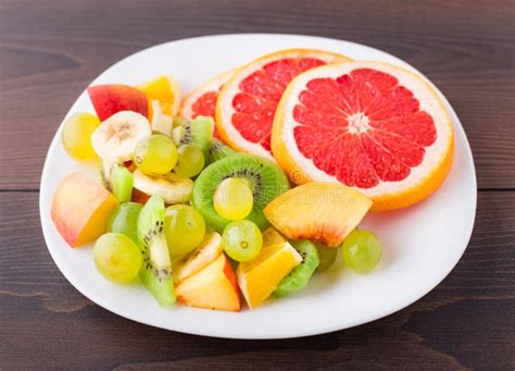 Assortment Of Sliced Fruits On Plate Stock Photo Image Of Salad