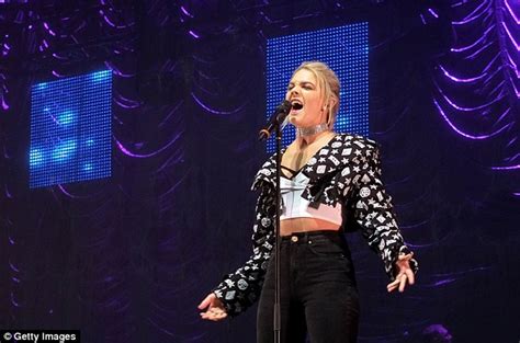 louisa johnson flashes her taut abs in a white crop top at christmas concert after lashing