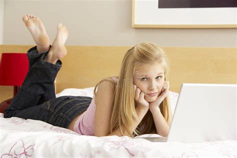 teenage girl using laptop in bedroom stock image image of people length 11501383