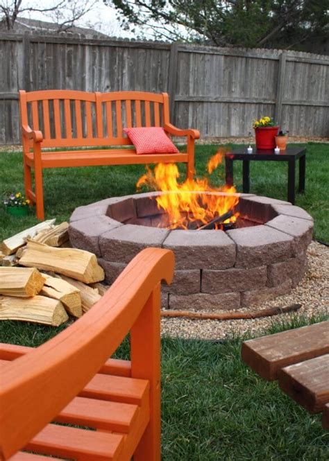 Round Brick Fire Pit Surrounded By A Row Of Tiny Gravel Built In The