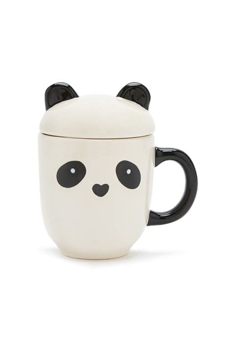 a ceramic mug featuring a panda face and a contrast handle as well as a lid with protruding