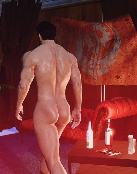 A Naked Man Standing In Front Of A Red Couch Next To A Table With Bottles On It