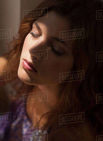 Portrait Of Beautiful Woman With Eyes Closed Stock Photo Dissolve