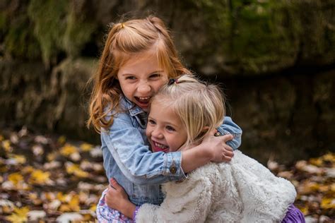 2 Girls Hugging Each Other Outdoor During Daytime · Free Stock Photo