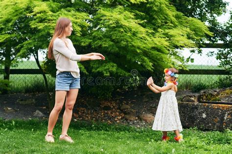 Young Mother Dancing With Cute Little Daughter Stock Image Image Of