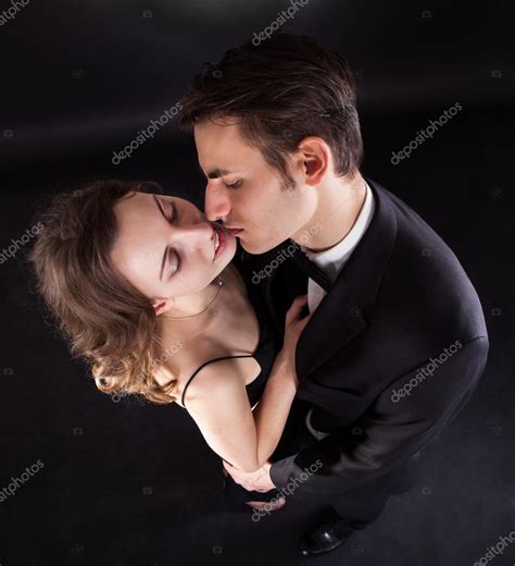 Passionate Couple Kissing Over Black Background Stock Photo By