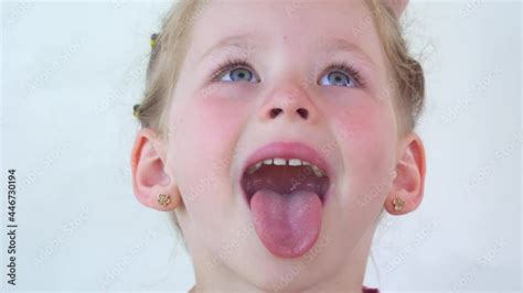 Little Girl Show Tongue Throat Portrait With Wide Open Mouth And