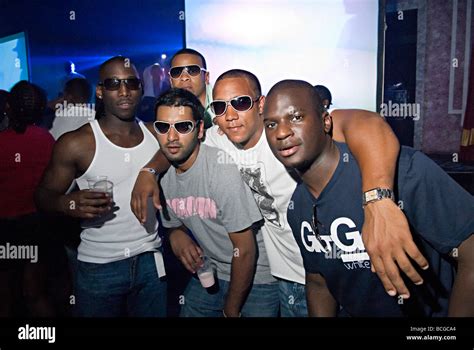 A Group Of Black Males In A Weekender Nightclub In Norfolk Posing Enjoying Themselves Stock