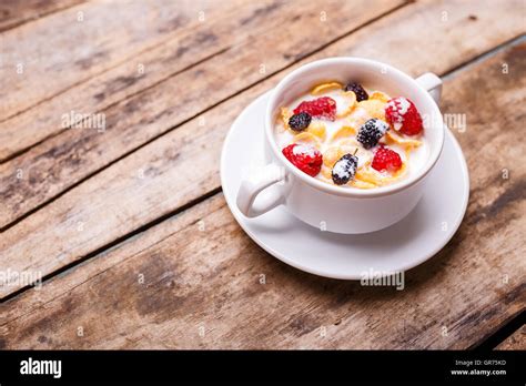 Breakfast Menu Background Corn Flakes With Berries And Milk In White