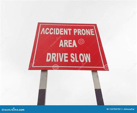 Drive Slow Accident Prone Area Sign Board On The Highway Roadside