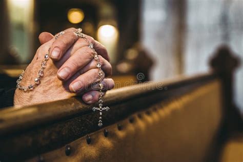 Praying Hands With Rosary In Church Stock Photo Image Of Symbol