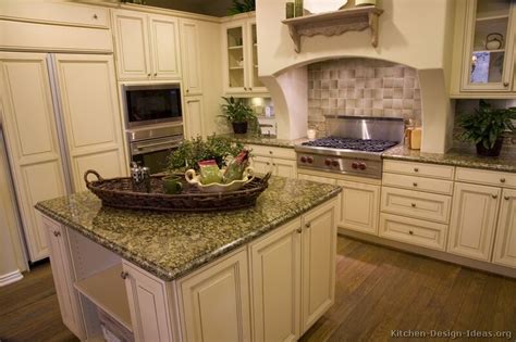 Though this kitchen's range and cabinets are both white, one has brass hardware i know, i know — white cabinets should mean a white and bright kitchen, but hear us out. Pictures of Kitchens - Traditional - Off-White Antique ...