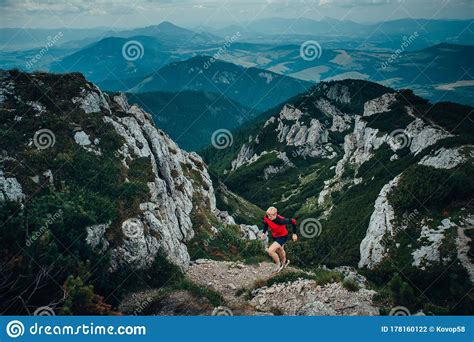 Trail Run In Rocky Mountains Athlete In Beautiful Nature Rocks And