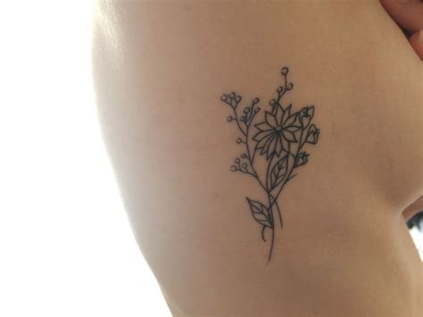 Wildflower Rib Tattoo Rib Tattoo Tattoos Leaf Tattoos