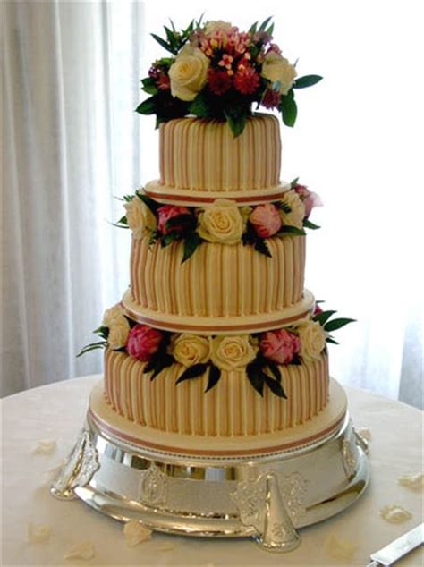Photo Of Yellow Wedding Cake With Yellow And Peach Pink Roses