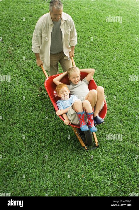 Children Pushing Wheelbarrows Hi Res Stock Photography And Images Alamy
