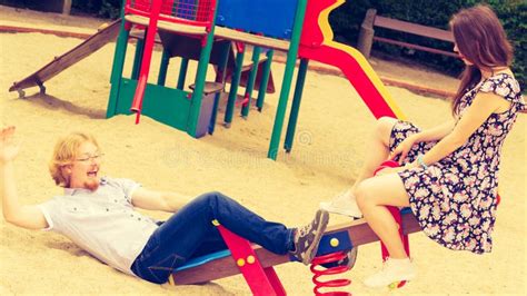 funny couple playing on playground stock image image of enjoyment togetherness 198554473