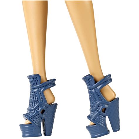 A Doll S Legs Wearing Blue High Heels With Holes In The Middle And Heel