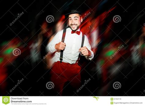 The Groom Dancing On Dance Floor Moving In Motion Cheerful Man Wearing Hat And Bow Tie With