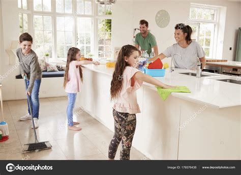 Children Helping Parents With Household Chores Stock Photo By