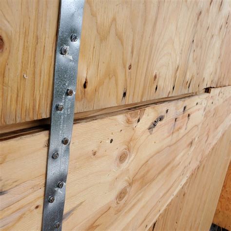 Attach z braces to the doors using wooden screws and building adhesive after laying the doors flat on the ground. Bad sheathing installation - AK House Project