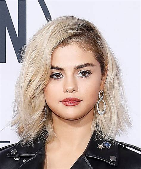Selena gomez hairstyles：subtle chignon for elegant girls. Celebrity Hairstyles in 2019