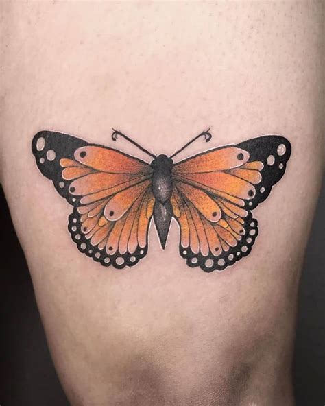 Medium Sized Color Tattoo On Womans Thigh Of Orange Realistic