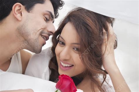 Man Whispering In Womans Ear Photo Background And Picture For Free