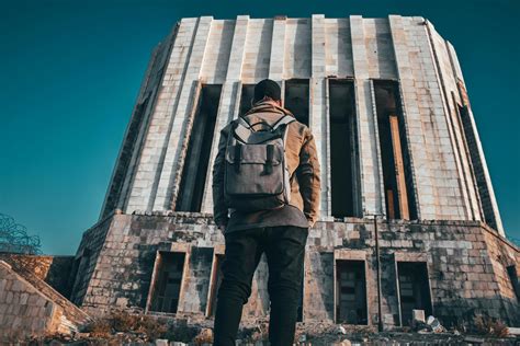 Man Standing In Front Of The Building · Free Stock Photo