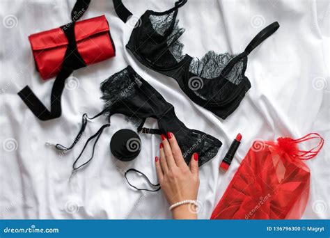 Female Hand On Set Of Glamorous Stylish Lace Lingerie With Woman Accessories Beauty Products