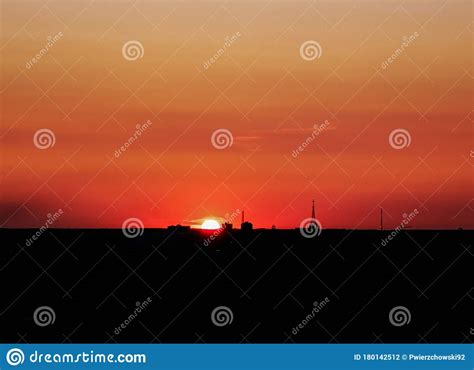 Sun Hiding Behind Horizon At Sunny Golden Hour Stock Photo Image Of