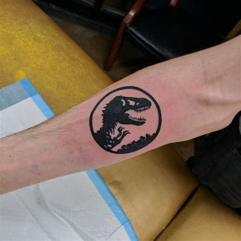 Jurassic Park Tattoo Done By Jeremy Lewis At Sickle And Moon Tattoo