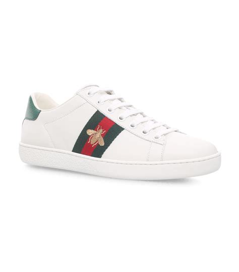 Crafted in italy from smooth leather, they feature the house's signature green and red web. Gucci Denim New Ace Bee Low Sneakers in White - Lyst