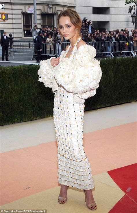 Lily Rose Depp Makes Met Gala Debut In Plunging White Gown Daily Mail