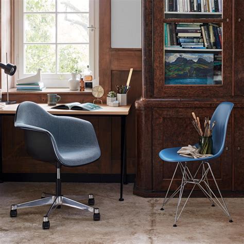 Armchair and side chair shells can be fully upholstered in a variety of textiles; Eames Plastic Side Chair DSR by Vitra