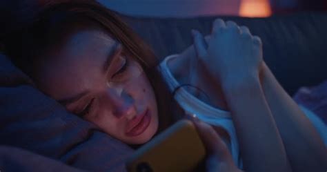 Close Up Of Young Depressed Girl Crying While Reading Old Messages On Her Smartphone Sad Woman