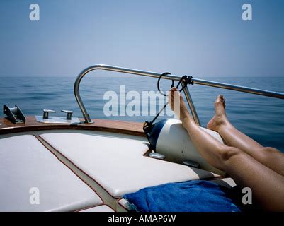 Topless Woman Sunbathing On A Boat Stock Photo Alamy