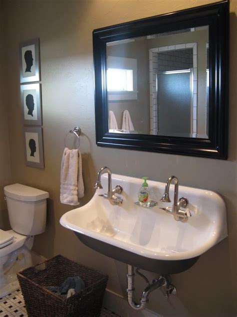 This traditional bathroom vanity has the look of breakfront cabinetry with upper cabinets that sit atop the counter to frame the bathroom sink. Kohler Trough Sink for Bathroom - HomesFeed