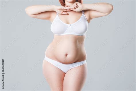 Woman With Fat Abdomen Overweight Female Body On Gray Background Stock