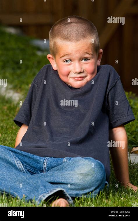 Boy Sitting Outside Stock Photo Alamy