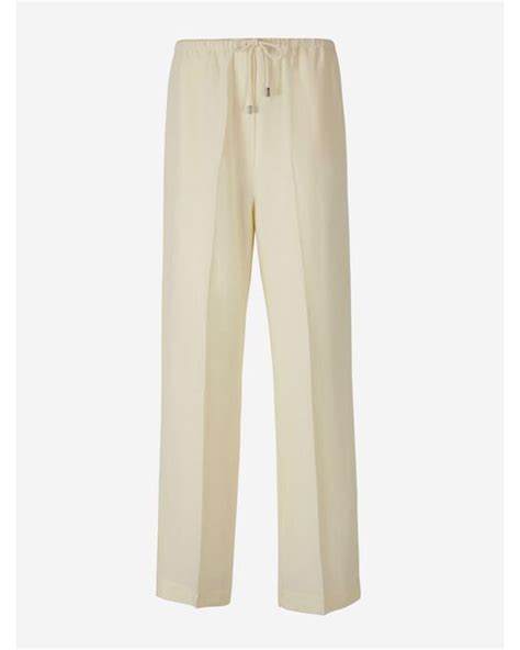 Totême Pleated Pants In Natural Lyst