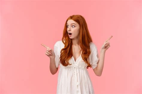 Premium Photo Amazed Young Redhead Girl With Fingers Up