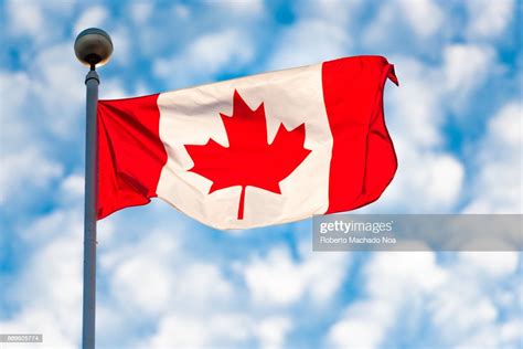 Torontocanada Canadian National Flag Waving On A Partially Cloudy Sky