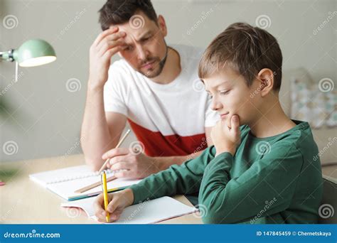 Dad Struggling To Help His Son With School Assignment Stock Image Image Of Exercise Ideas