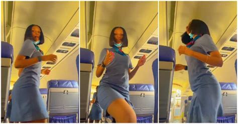 beautiful female flight attendant records herself as she dances with her waist in an aeroplane