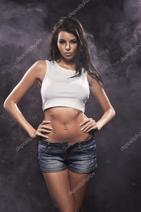 Sexy Beautiful Brunette Woman Posing In Jeans Shorts Stock Photo By Aarrttuurr