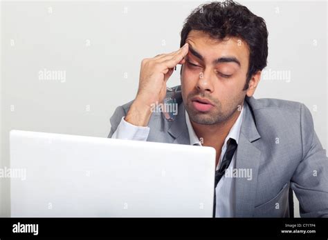 Businessman Feeling Sleepy At Work Stock Photo Alamy
