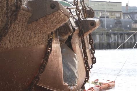 first tugboat successfully raised after devonport accident with cement carrier ship goliath