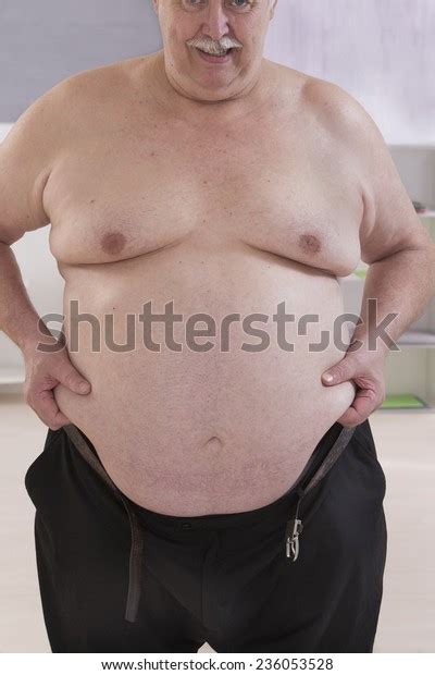 Fat Man Touching His Stomach Stock Photo Edit Now