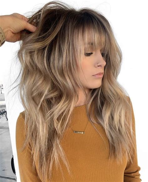 Alongside this revamping, bangs of the right density, length, and shape can balance facial features and make medium layered haircuts more flattering. Pin on Hair Beauty